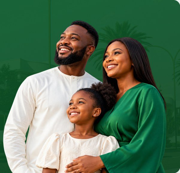 A smiling family looking towards their future home